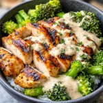 Delicious Grilled Chicken & Broccoli Bowls with Creamy Garlic Sauce ready to serve.