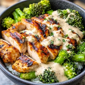 Delicious Grilled Chicken & Broccoli Bowls with Creamy Garlic Sauce ready to serve.