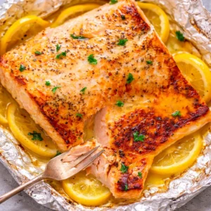 Delicious Sheet Pan Lemon Garlic Butter Salmon with asparagus and baby potatoes.